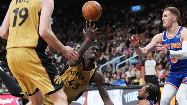 Toronto Raptors forward Pascal Siakam (43) collides with New York Knicks guard Jalen Brunson (11) during the fourth quarter at Scotiabank Arena.